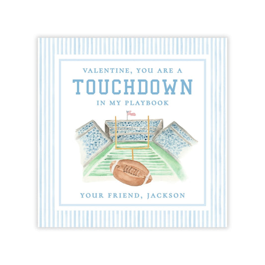 The image is a book cover for "Valentine, You Are a Touchdown in My Playbook" by Jackson, featuring a football field and a football.