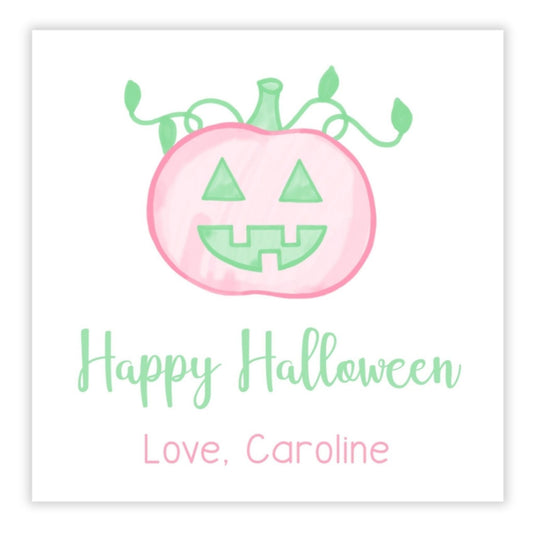 A personalized Halloween gift tag featuring a pink pumpkin design with the text 'Happy Halloween' and a custom message 'love, caroline'.