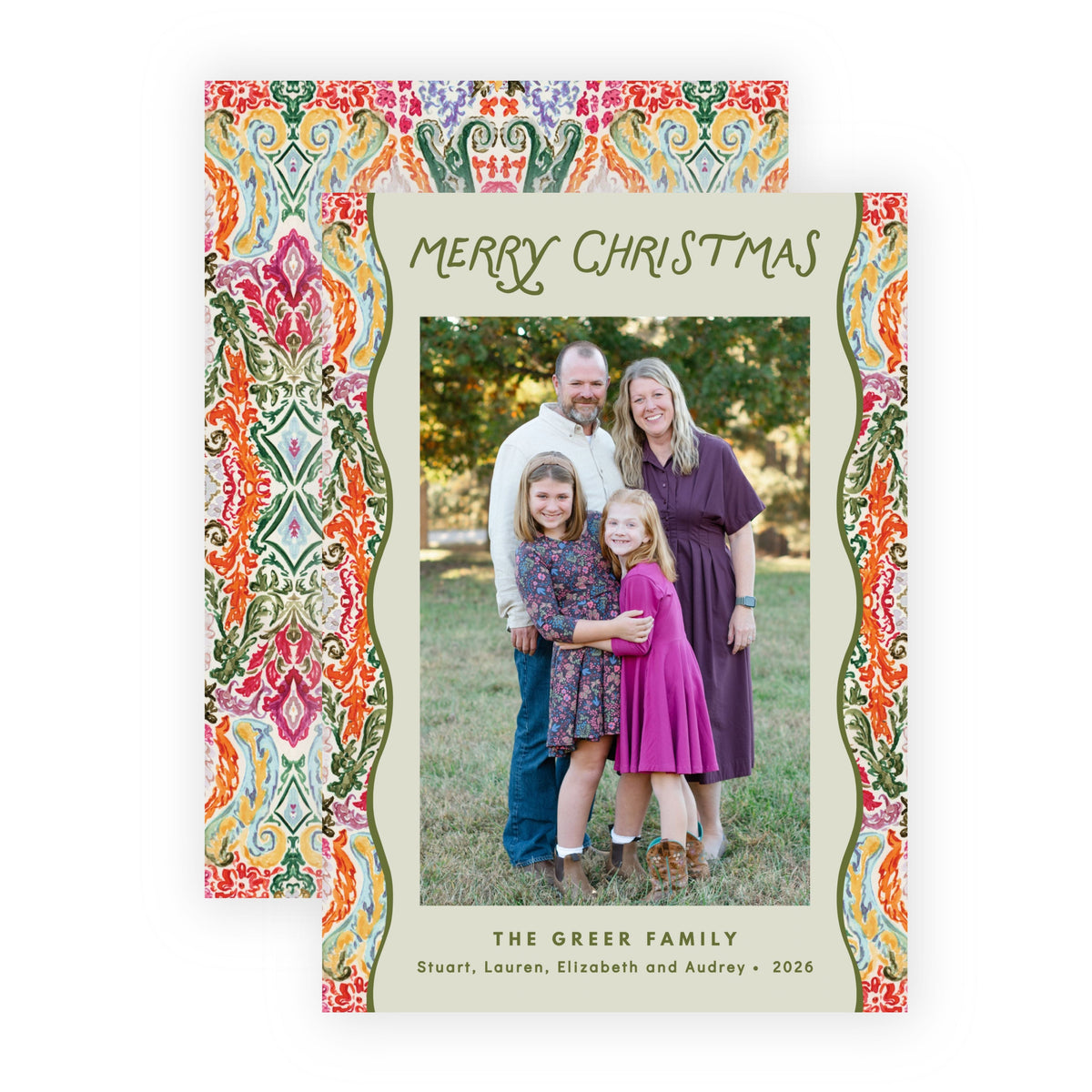Two personalized Christmas family photo cards with a colorful ornate border and green script text, displayed on a clean white background.