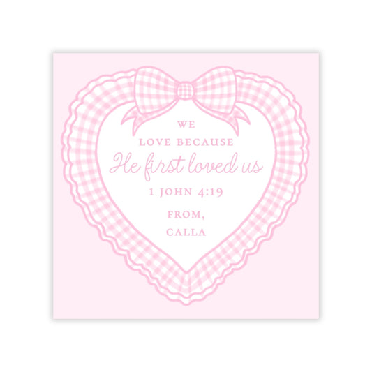 The image is a pink heart-shaped graphic with a bow and text, likely a greeting or message.