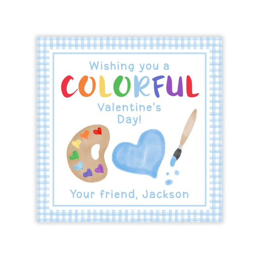 The image is a Valentine's Day greeting card with a blue and white checkered border. The card features a paint palette, a heart, and a paintbrush, along with the text "Wishing you a COLORFUL Valentine's Day!" and "Your friend, Jackson".