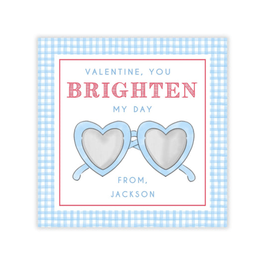 The image is a Valentine's Day card with a pair of heart-shaped sunglasses as the main visual element. The text on the card reads "Valentine, you BRIGHTEN MY DAY FROM, JACKSON".