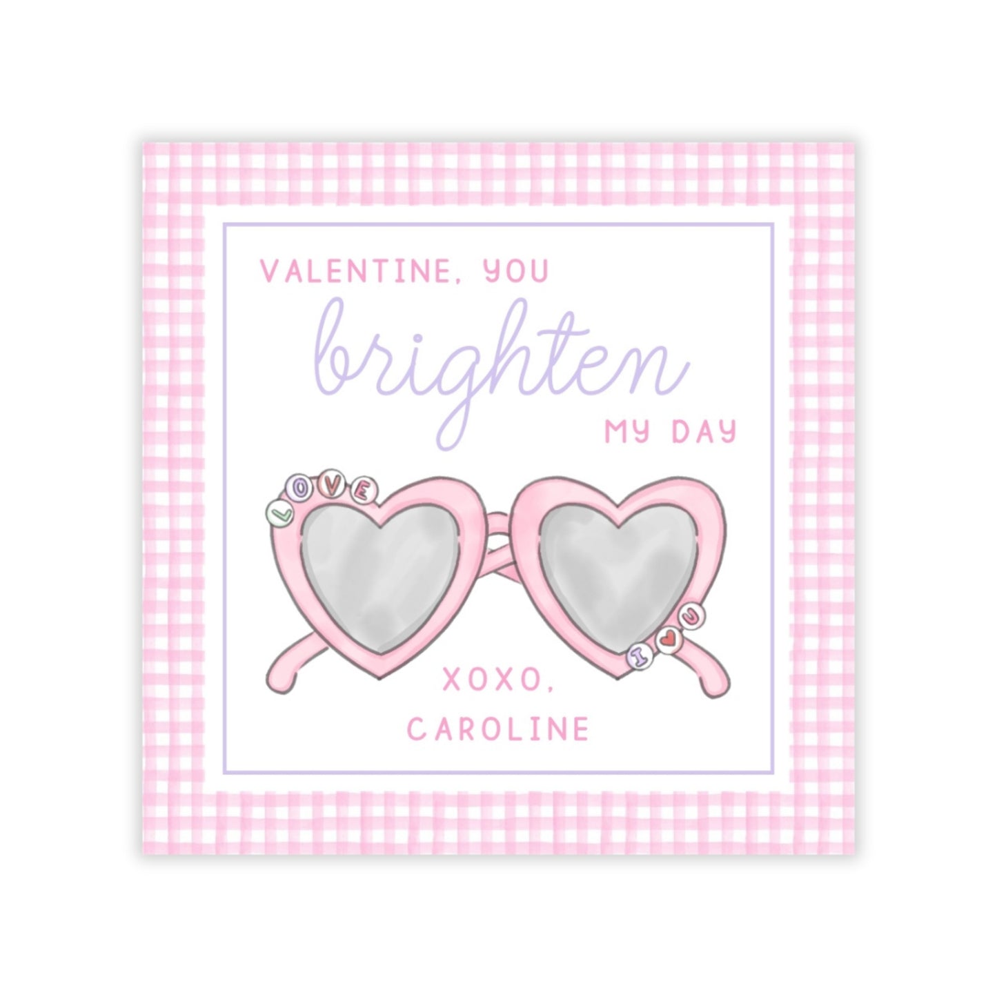 The image is a Valentine's Day card with a pink and white checkered border. The card features a pair of heart-shaped sunglasses with a message that reads "Valentine, you brighten my day" and "XOXO, CAROLINE".