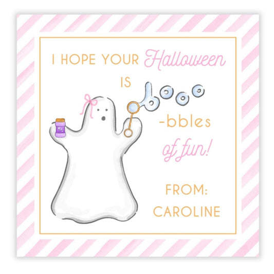 A personalized Halloween gift tag with a watercolor illustration of a white ghost holding a bottle, with pink and orange stripes in the background, and custom text that reads 'I hope your Halloween is -bubbles of fun! From Caroline'.