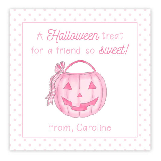 A personalized Halloween gift tag featuring a pink pumpkin design with the text 'A Halloween treat for a friend so sweet!' and a custom message 'From: Caroline'.