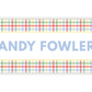 a rectangular sign with a checkered pattern and the name "ANDY FOWLER" written in blue text.