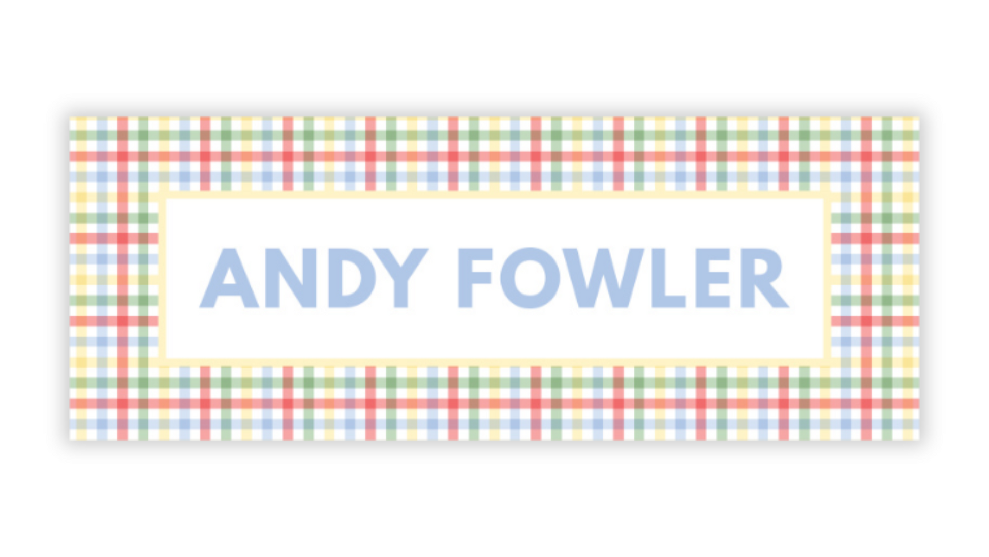 a rectangular sign with a checkered pattern and the name "ANDY FOWLER" written in blue text.